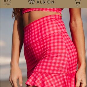 Albion Fit Santorini high-waisted Pink Gingham Ruffle Mini swim Skirt
